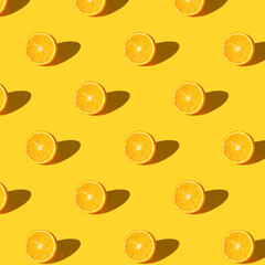 Trendy summer Seamless pattern of juicy orange lemon with shadow on sunlight yellow background....