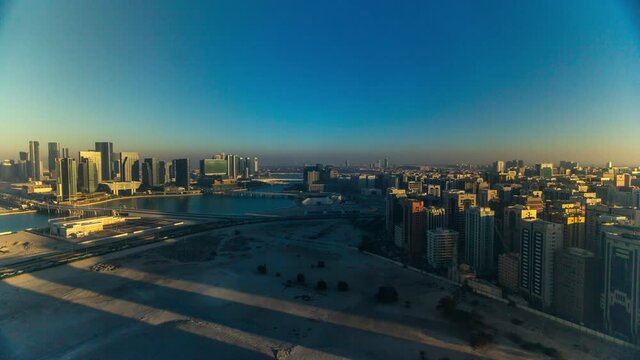 Aerial skyline of Abu Dhabi city centre from above during all day timelapse