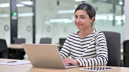 Naklejka na ściany i meble Serious Indian Woman with Laptop saying No by Head Shake 