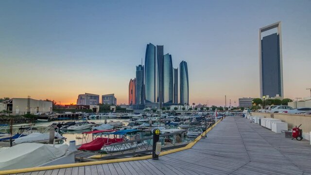 Al Bateen marina Abu Dhabi timelapse with modern skyscrapers on background