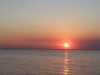 Fototapeta premium Beautiful sunset over the sea in early autumn near the village of Sukko in the North Caucasus