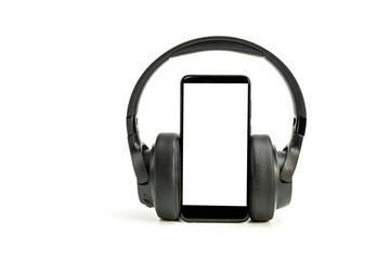 headphones with Bluetooth technology on white background, with black phone paired for music lovers
