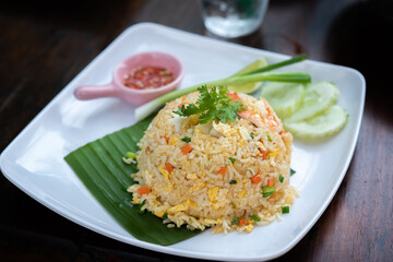 Fried rice with shrimp in white plate.