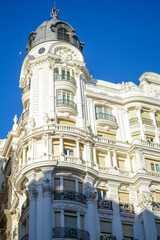 Obraz premium Madrid, Spain - October 25, 2020: Beautiful architecture located Gran Via street one of the city biggest streets