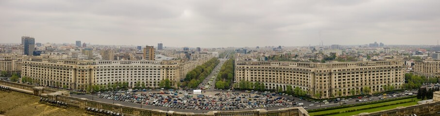Fototapeta premium Bucharest, Romania - April 29, 2021: Panorama of Bucharest as seen from the Palace of Parliament, on a cloudy spring day.