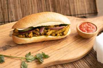 Indian Surinamese sandwiches filled with roti chicken curry,  cod fish or tandoori chicken 