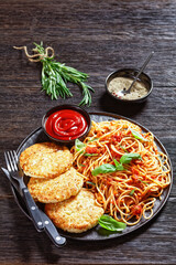 cod fish patties with pasta, top view