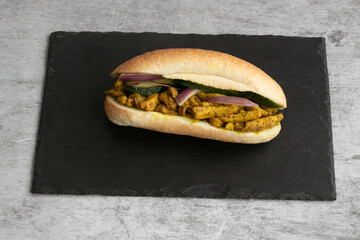 Indian Surinamese sandwiches filled with roti chicken curry,  cod fish or tandoori chicken 