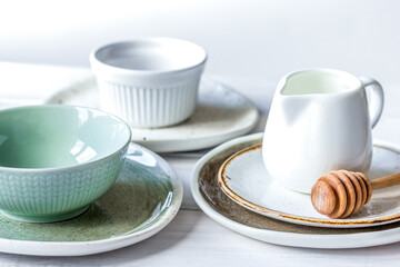 ceramic tableware with flowers on white background