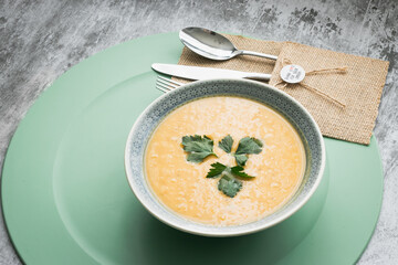 Dahl soup with yellow lentils on a table, lunch or dinning