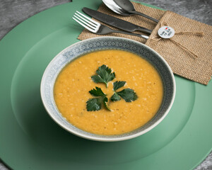 Dahl soup with yellow lentils on a table, lunch or dinning