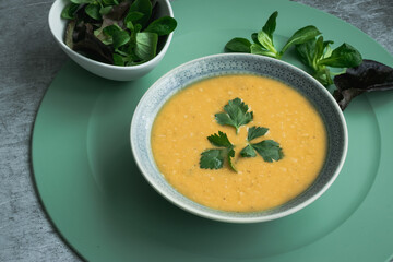 Dahl soup with yellow lentils on a table, lunch or dinning