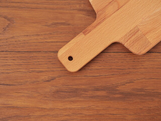 Cutting board or chopping board on wooden table. Wooden plate on desk. Top view