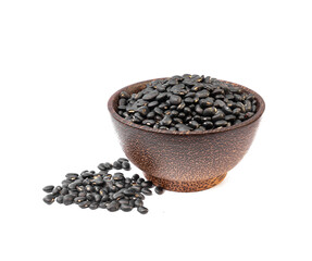 Black beans in wooden bowl on white background