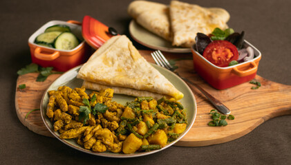 Indian-surinamese spicy food lunch and dinner, roti chicken curry