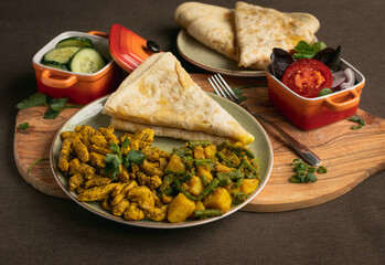 Indian-surinamese spicy food lunch and dinner, roti chicken curry