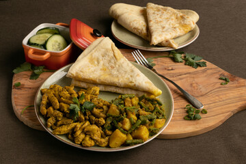 Indian-surinamese spicy food lunch and dinner, roti chicken curry