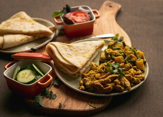 Indian-surinamese spicy food lunch and dinner, roti chicken curry