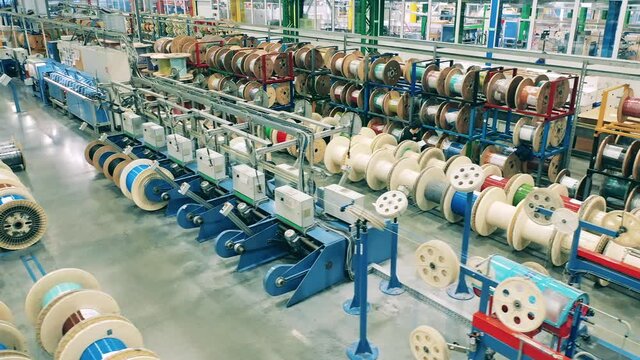 Top view of multiple cable reels stored at a cable manufacturing facility