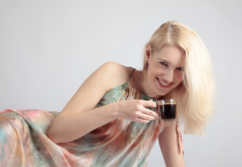 Portrait of a beautiful mid-age woman with cup of coffee.
