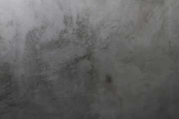 Gray background of cement plaster on the wall of the house