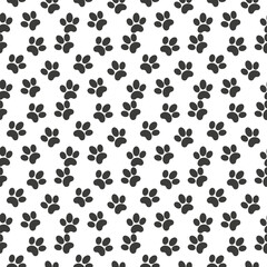 Fototapeta na wymiar Vector seamless pattern of flat black animal dog cat foot print steps isolated on white background