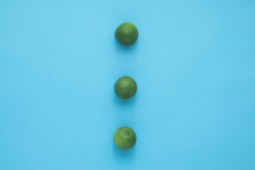 Natural fresh lime isolated on blue background