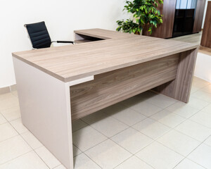 office room interior with desk and armchair. A sample of office furniture in a furniture showroom.
