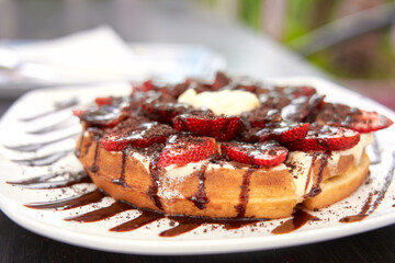 Waffle with cream served to eat.