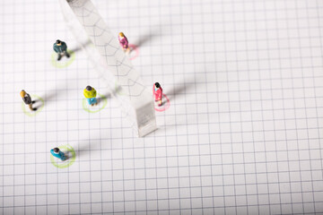 Social distancing, people keeping distance  to protect COVID-19 coronavirus outbreak spreading concept, miniature keep distance each other using plexiglass.