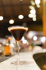 A cocktail blending with black coffee.