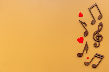 Love songs - musical wooden notes with heart, top view