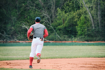 player running on baseball match.