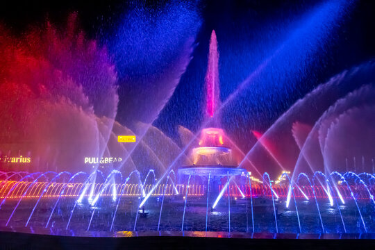 BUCHAREST, ROMANIA - OCTOBER 19, 2019: The Water Symphony Show, modernized fountain installation in Union Square, Piata Unirii. Beautiful synchronized show of colorful lights, music and water jets.