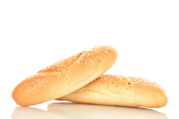 Two delicious fragrant bagels with a jute napkin, close-up, isolated on white.