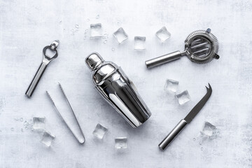 Set of cocktail drink tools and ingredients with shaker and ice. Flat lay