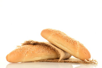Two delicious fragrant bagels with a jute napkin, close-up, isolated on white.