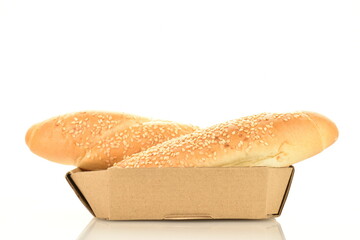Two delicious fragrant bagels in a paper plate, close-up, isolated on white.