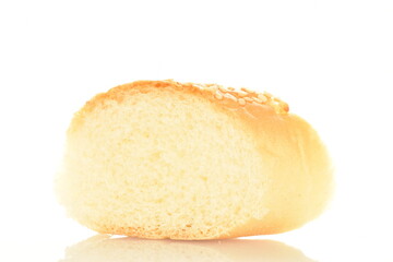 One slice of flavored bagel sprinkled with sesame seeds, close-up, isolated on white.