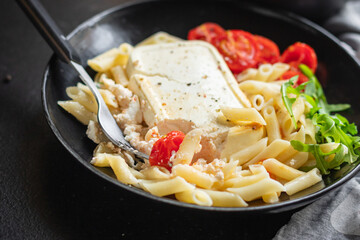 fetapasta penne tomato spices, feta cheese feta pasta second course snack trend meal copy space rustic food background top view