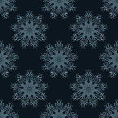 Fototapeta na wymiar Seamless pattern of winter snowflakes. Good for covers, fabrics, postcards and printing.