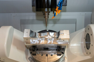 The hi-precision 5-axis machining center cutting the shoe mold parts. Hi-technology  mold and die...