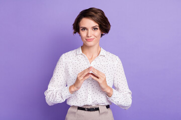 Photo of positive young girl arms fingers together thinking have good mood isolated on violet color...