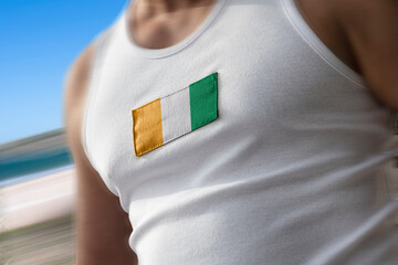 The national flag of Cote dIvoire on the athlete's chest