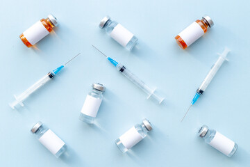 Vaccination with Covid vaccine in bottles with syringe