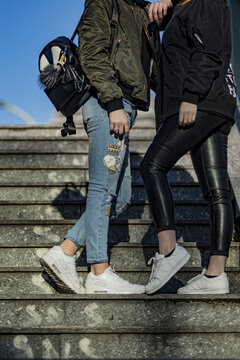oung man and woman wearing Nike Air Max 90 and Adidas Superstar