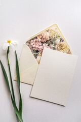 Mockup card with floral envelope and daffodils 