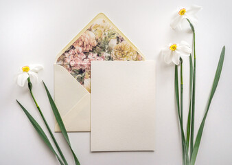 Mockup card with floral envelope and daffodils 
