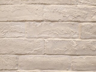 White painted brick wall in fluorescent lighting. Concept : Interior design , Architect material , Architecture background.