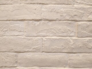 White painted brick wall in fluorescent lighting. Concept : Interior design , Architect material , Architecture background.